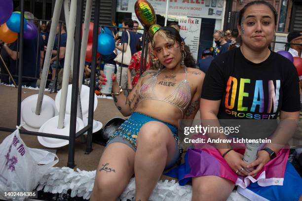 Participants and spectators mix and mingle at the Brooklyn Gay Pride parade on June 11, 2022 as it marches through the narrow streets around 5th...