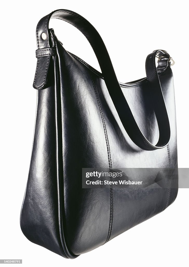 A black leather zipper top handbag