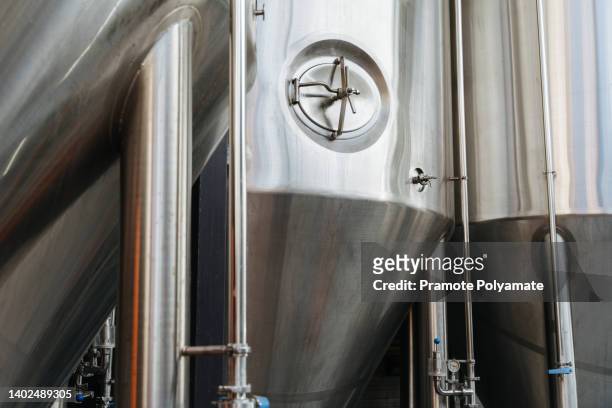 metal beer fermentation tank. brewer. - vat stock pictures, royalty-free photos & images