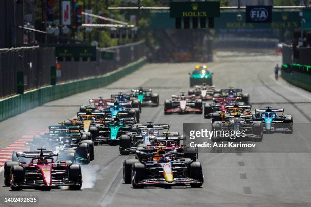 Carlos Sainz of Ferrari and Spain and Sergio Perez of Red Bull Racing and Mexico during the F1 Grand Prix of Azerbaijan at Baku City Circuit on June...