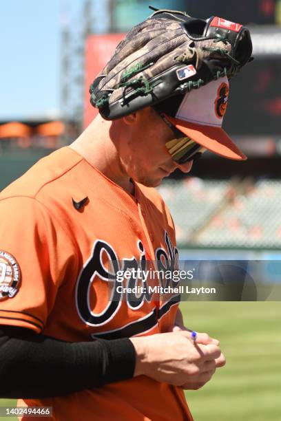 Austin Hays of the Baltimore Orioles signs autographs before a baseball game against the Cleveland Guardians at Oriole Park at Camden Yards on June...