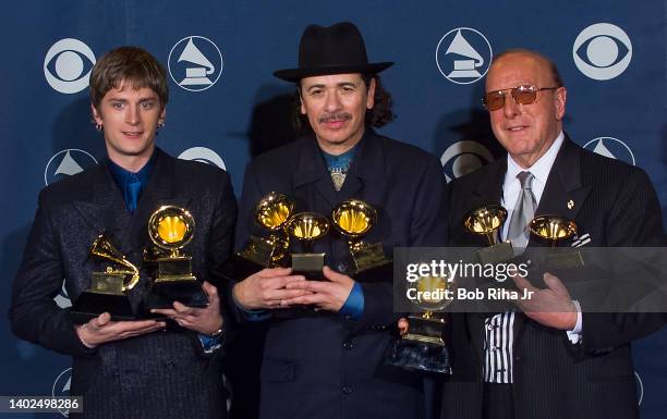 Multi-Grammy Winner Carlos Santana is joined by Rob Thomas and Clive Davis backstage at the Grammy Awards Show, February 23, 2000 in Los Angeles,...