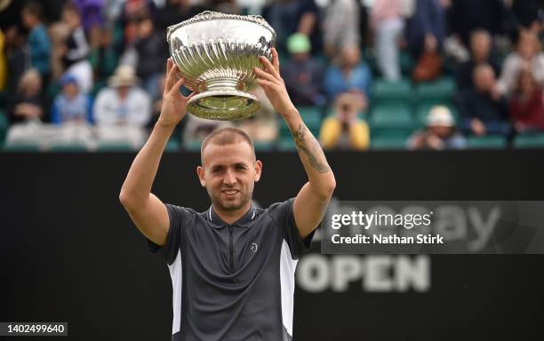 Dan Evans of Great Britain poses with the trophy after victory against Jordan Thompson of Australia in the men’s single final match during day nine...