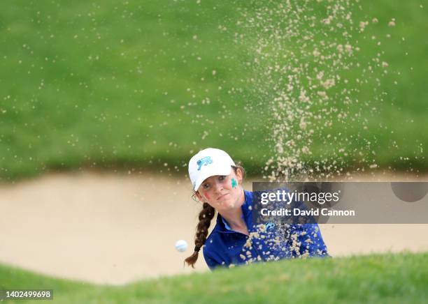 Lauren Walsh of Ireland and of The Great Britain and Ireland Team plays her third shot on the first hole in her match against Rachel Heck during the...