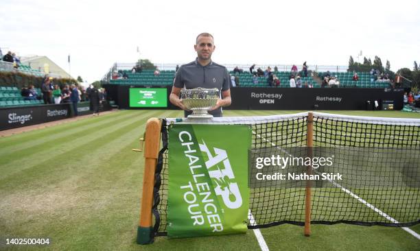 Dan Evans of Great Britain poses with the trophy after victory against Jordan Thompson of Australia in the men’s single final match during day nine...