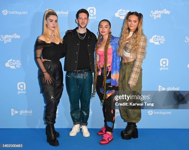 Sigala, Ella Eyre and Talia Mar walk the media line during Capital FM's Summertime Ball at Wembley Stadium on June 12, 2022 in London, England.