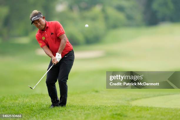 Thongchai Jaidee of Thailand chips onto the ninth green during the final round of the American Family Insurance Championship at University Ridge Golf...