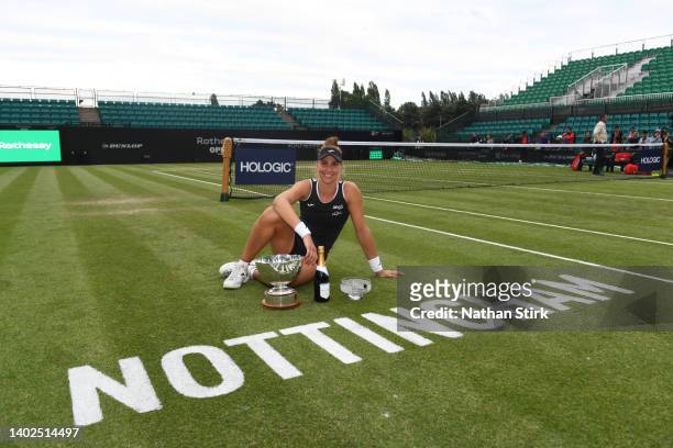 Beatriz Haddad Maia of Brazil poses with the Women's Singles and Women's Double Trophy during day nine of the Rothesay Open at Nottingham Tennis...