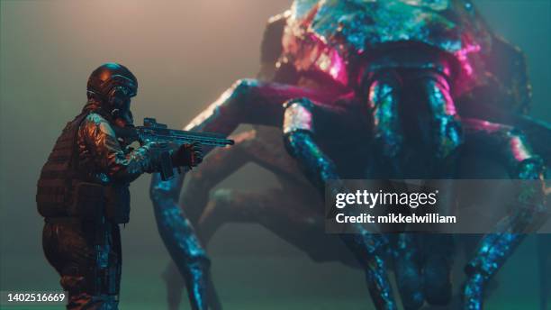 soldier gets ready to attack alien or a strange giant bug - winchester film stock pictures, royalty-free photos & images