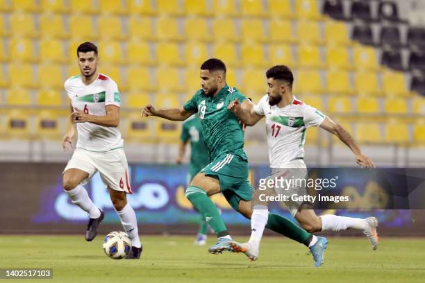 Saeid Ezatolahi of Iran, Adem Zorgane of Algeria and Ali Gholizadeh of Iran in action during the FIFA Friendly Regular Round match between Iran and...
