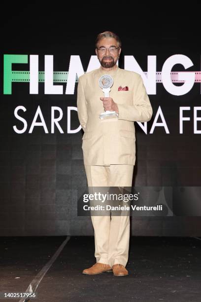 Kabir Bedi poses with the award during the Filming Italy 2022 red carpet on June 12, 2022 in Santa Margherita di Pula, Italy.