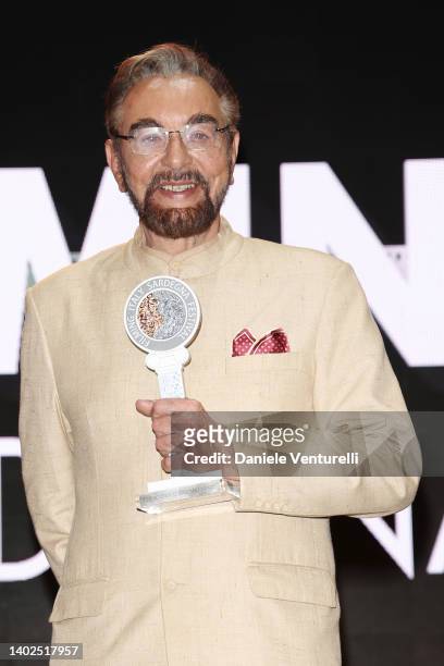 Kabir Bedi poses with the award during the Filming Italy 2022 red carpet on June 12, 2022 in Santa Margherita di Pula, Italy.