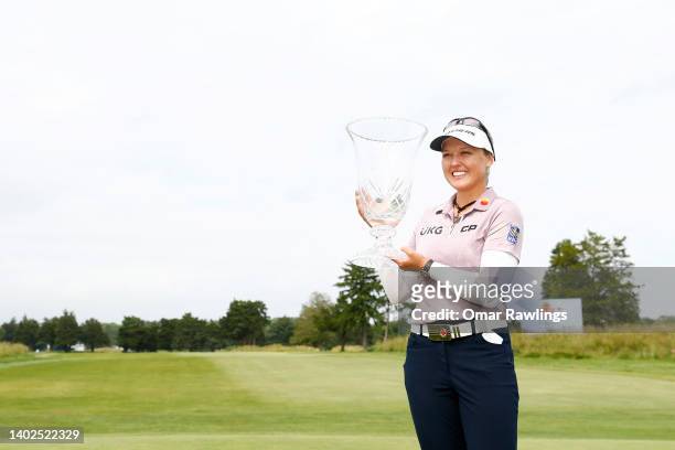 Brooke Henderson of Canada holds the trophy after her victory at the ShopRite Classic at Seaview Bay Course on June 12, 2022 in Galloway, New Jersey.