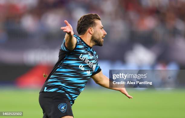 Kem Cetinay of Team World XI celebrates after scoring their team's second goal during the Soccer Aid for Unicef 2022 match between Team England and...