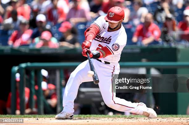 Keibert Ruiz of the Washington Nationals hits a double in the second inning against the Milwaukee Brewers at Nationals Park on June 12, 2022 in...