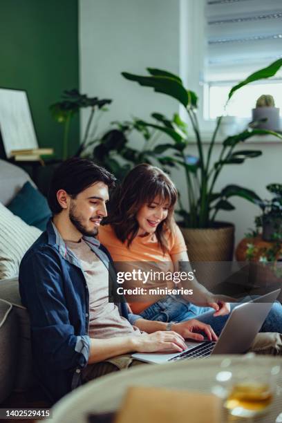 Couple Using One Computer 1,576 Couple Searching On Laptop Stock Photos, High-Res Pictures, and ...