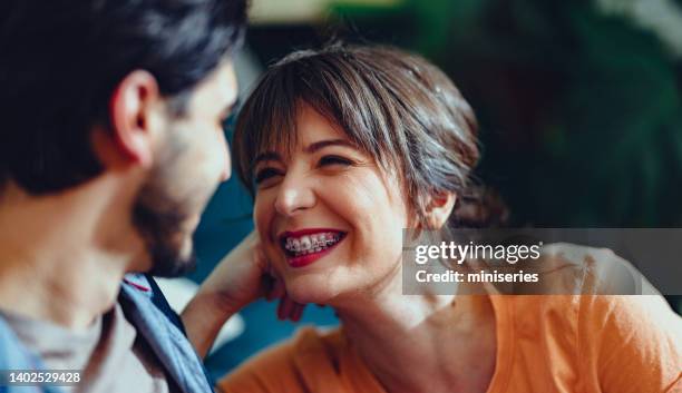 affectionate couple relaxing at home - aparelho dentário imagens e fotografias de stock