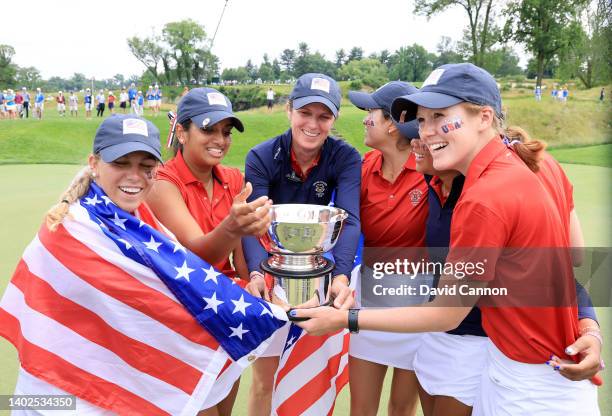 Jensen Castle, Megha Ganne, Rose Zhang and Emilia Migliocci celebrate with The United States Team captain Sarah LeBrun Ingram after the singles...