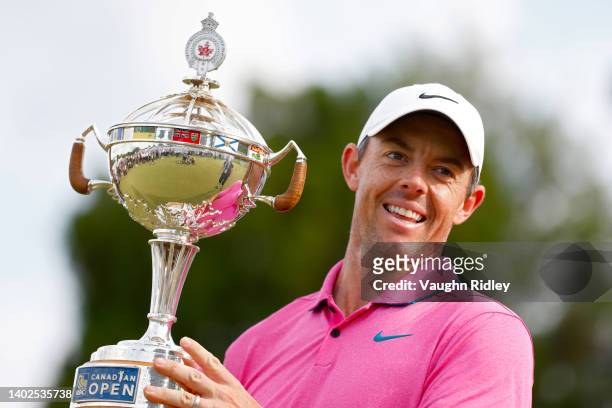 Rory McIlroy of Northern Ireland celebrates with the trophy after winning the RBC Canadian Open at St. George's Golf and Country Club on June 12,...