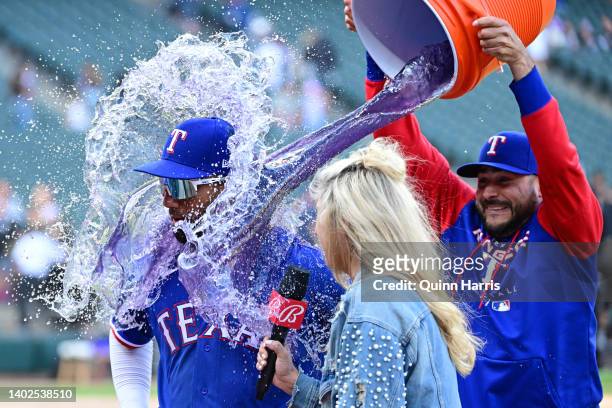 Ezequiel Duran of the Texas Rangers is doused after an 8-6 win against the Chicago White Sox at Guaranteed Rate Field on June 12, 2022 in Chicago,...