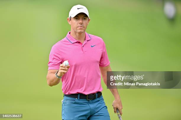 Rory McIlroy of Northern Ireland reacts after making par on the 15th green during the final round of the RBC Canadian Open at St. George's Golf and...