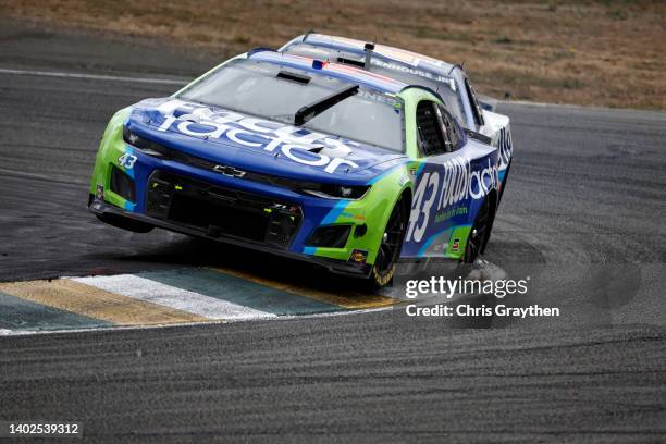 Erik Jones, driver of the FOCUSfactor Chevrolet, and Ricky Stenhouse Jr., driver of the Kroger/Cottonelle Chevrolet, race during the NASCAR Cup...