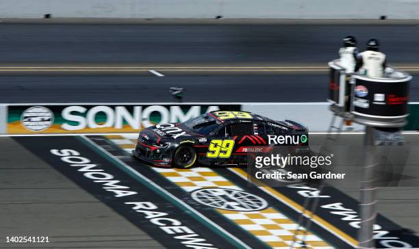 Daniel Suarez, driver of the Onx Homes/Renu Chevrolet, crosses the finish line to win the NASCAR Cup Series Toyota/Save Mart 350 at Sonoma Raceway on...