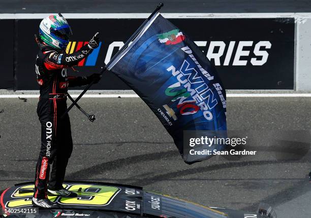 Daniel Suarez, driver of the Onx Homes/Renu Chevrolet, celebrates after winning the NASCAR Cup Series Toyota/Save Mart 350 at Sonoma Raceway on June...