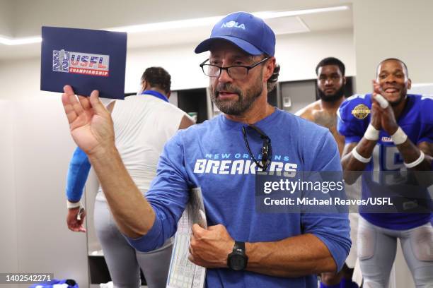 Head coach Larry Fedora of the New Orleans Breakers presents the invitation to the playoffs to the team in the locker room after defeating the Tampa...