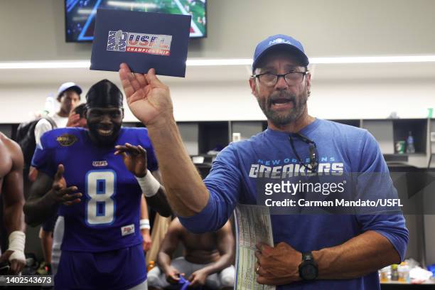 Head coach Larry Fedora of the New Orleans Breakers presents the invitation to the playoffs to the team in the locker room after defeating the Tampa...