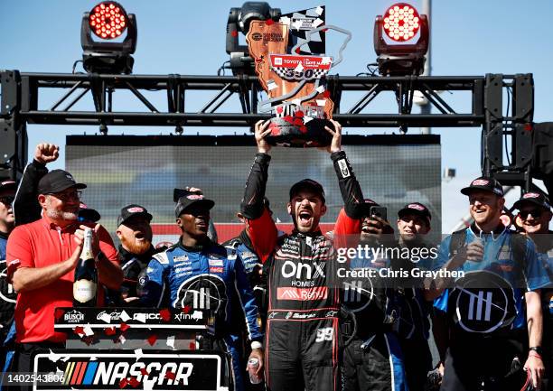 Daniel Suarez, driver of the Onx Homes/Renu Chevrolet, celebrates in victory lane after winning the NASCAR Cup Series Toyota/Save Mart 350 at Sonoma...