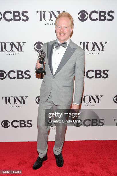 Jesse Tyler Ferguson poses in the press room after winning Best Performance by an Actor in a Featured Role in a Play for "Take Me Out" during the...