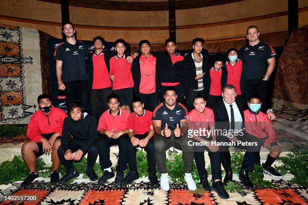 Josh Lord, Samisoni Taukei’aho, Sam Cane and Ian Foster of the All Blacks pose for a photo with school children following the New Zealand All Blacks...