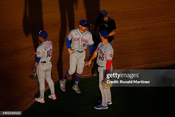 Brandon Nimmo, Pete Alonso and Eduardo Escobar of the New York Mets celebrate a 4-1 win against the Los Angeles Angels in the ninth inning at Angel...