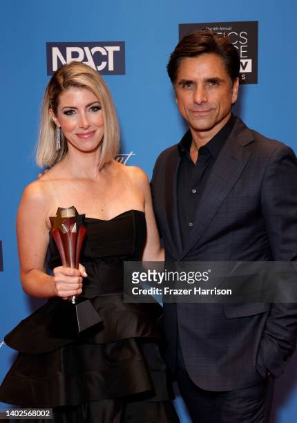 Kelly Rizzo, accepting the Impact Award on behalf of the late Bob Saget, and John Stamos attend the 4th Annual Critics Choice Real TV Awards at...
