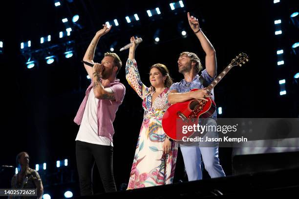 Charles Kelley, Hillary Scott, and Dave Haywood of Lady A perform during day 4 of CMA Fest 2022 at Nissan Stadium on June 12, 2022 in Nashville,...