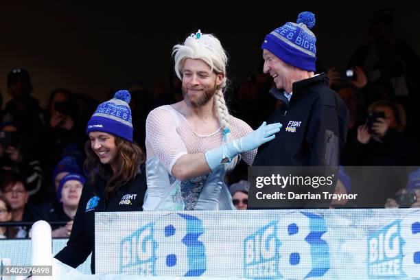 Rebecca Daniher and Neale Daniher are seen before Hamish Blake, Australian comedian, goes down the slide for Big FightMND Freeze 8, during the round...