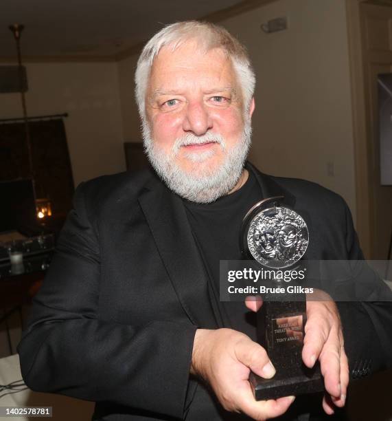 Simon Russell Beale poses in the press room after winning the award for Best Performance by an Actor in a Leading Role in a Play for " The Lehman...