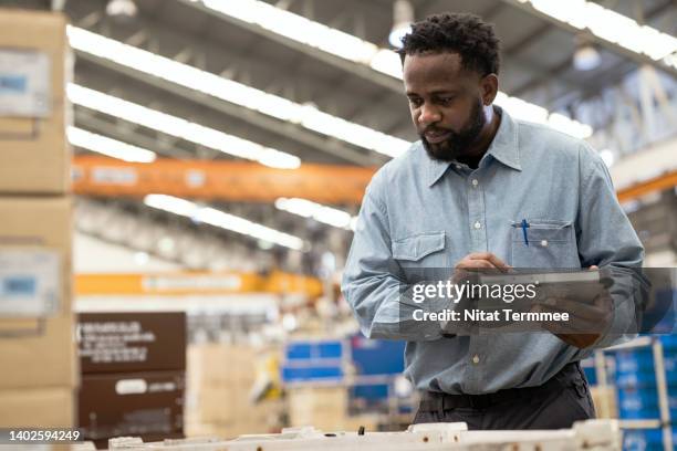 plastic injection molded part inspection in manufacturing industry. a male african american quality control engineer inspecting the finish product of plastic auto parts about structural and surface defects based on quality standard. - software as a service stock pictures, royalty-free photos & images