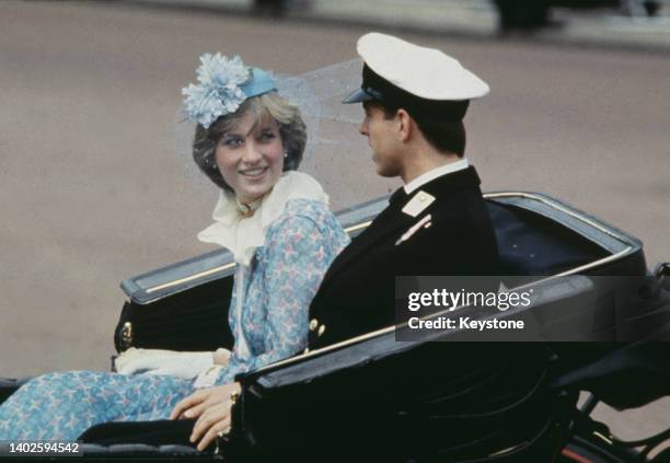 British Royals Lady Diana Spencer , wearing a blue floral Bill Pashley outfit with a matching hat, and Prince Andrew in a carriage during the...
