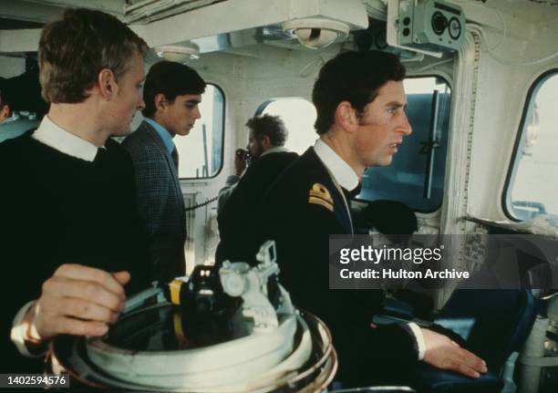 Charles, Prince of Wales, who is a Royal Navy sub-lieutenant, with Royal Navy personnel, on the bridge of HMS Minerva in Plymouth, Devon, England,...