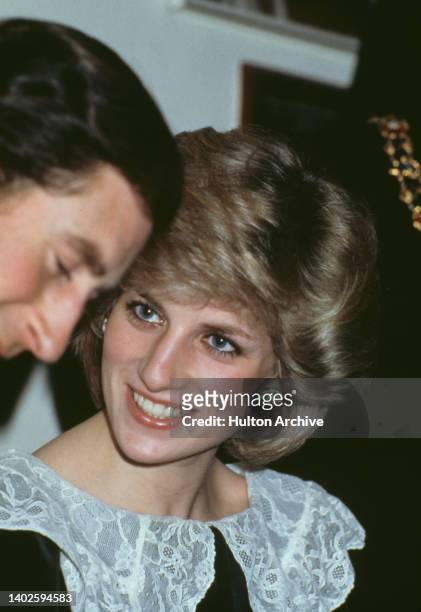 British Royals Charles, Prince of Wales and Diana, Princess of Wales , wearing a velvet Gina Frattini dress with a lace collar, attend a Christmas...