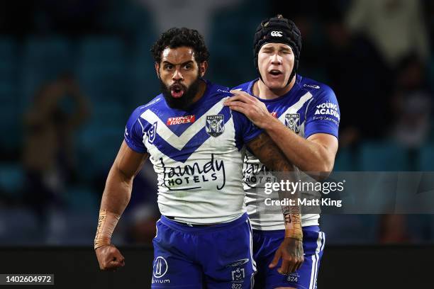 Josh Addo-Carr of the Bulldogs celebrates with Matt Burton after scoring a try during the round 14 NRL match between the Canterbury Bulldogs and the...