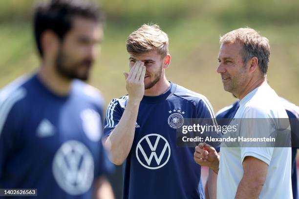 Head coach Hans-Dieter Flick, talks to his player Timo Werner during a training session of the German national soccer team at Budapesti VSC training...