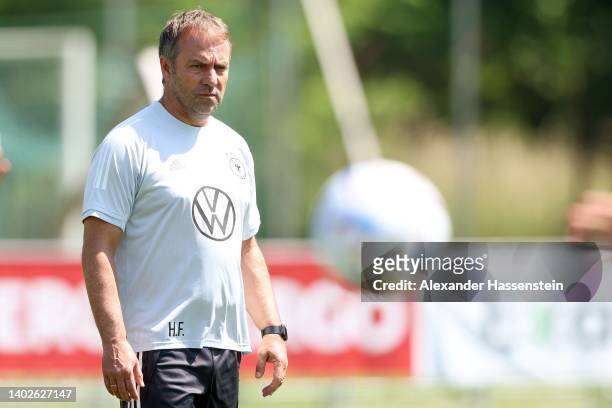 Head coach Hans-Dieter Flick looks on during a training session of the German national soccer team at Budapesti VSC training ground on June 13, 2022...