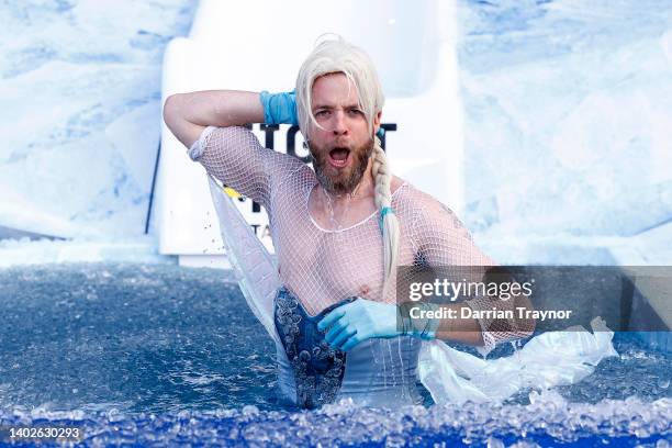 Hamish Blake, Australian comedian, goes down the slide for Big FightMND Freeze 8, during the round 13 AFL match between the Collingwood Magpies and...