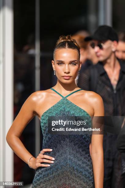 Hana Cross wears diamonds pendant earrings, a multicolored striped print pattern embroidered sequins long tube dress with an halter neck, silver and...