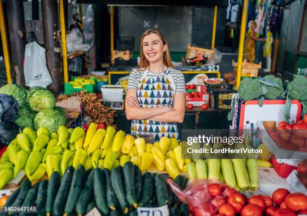 smiling young market vendor - homegrown produce stock pictures, royalty-free photos & images