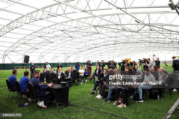 England Manager Gareth Southgate and Harry Kane of England speak to the media during a press conference at The Sir Jack Hayward Training Ground on...