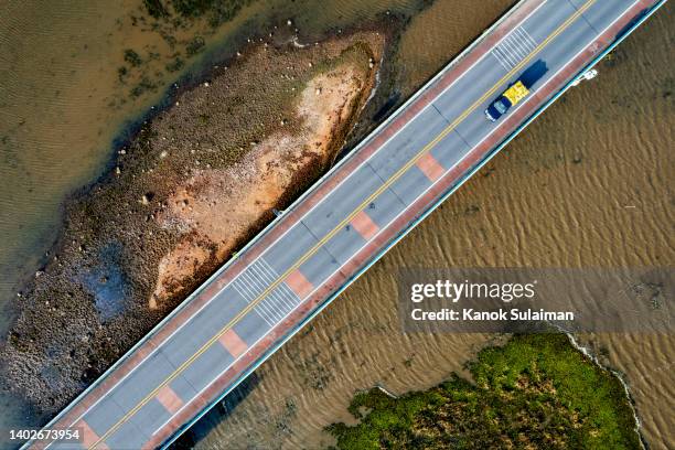 delivery pick-up truck on the road from above ,aerial view sunset scene of highway across the bridge at phatthalung,thailand - better view sunset stock pictures, royalty-free photos & images